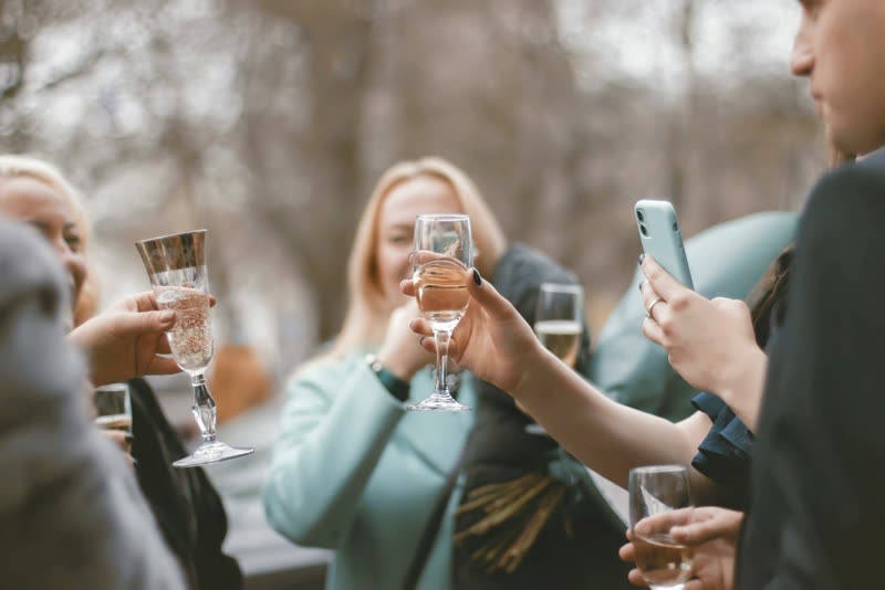 Friends clinking glasses together in a toast
