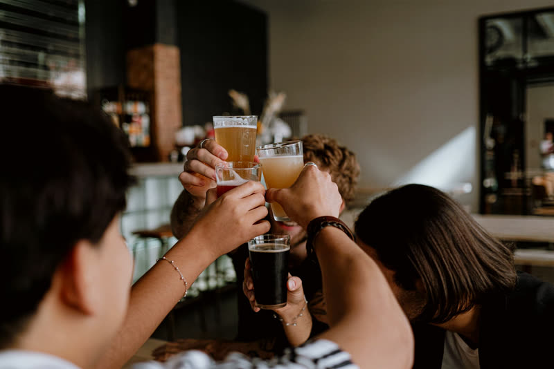 A group of friends raising their glasses together