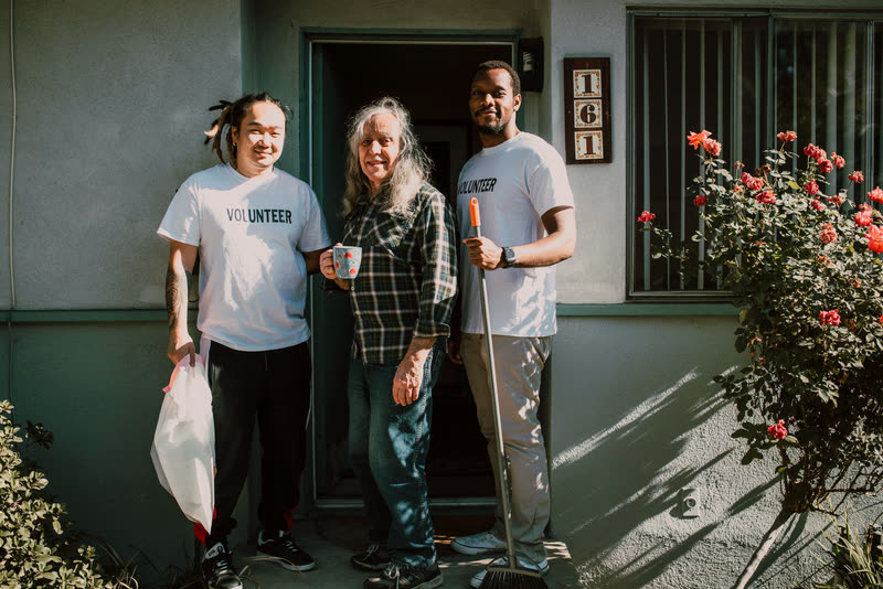 Volunteers helping a neighbor at their home