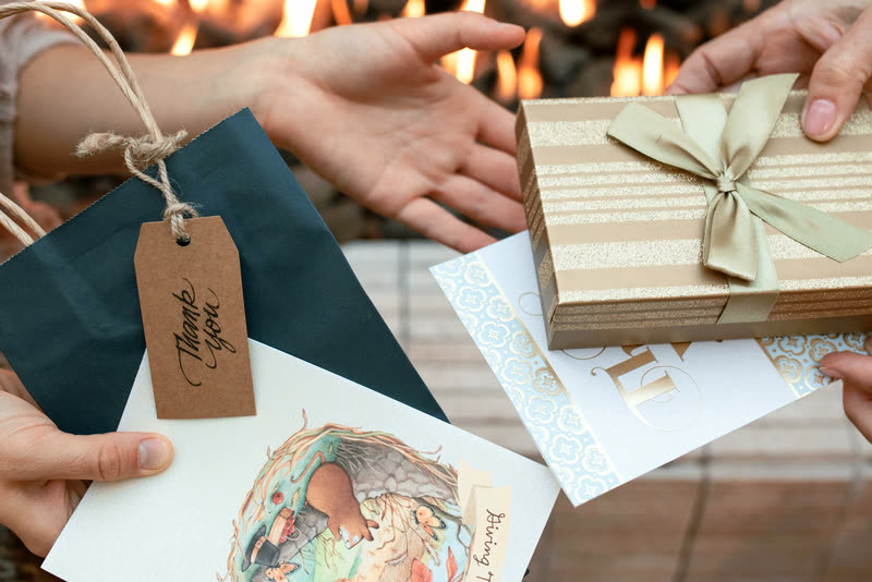 A gift passed between two people’s hands