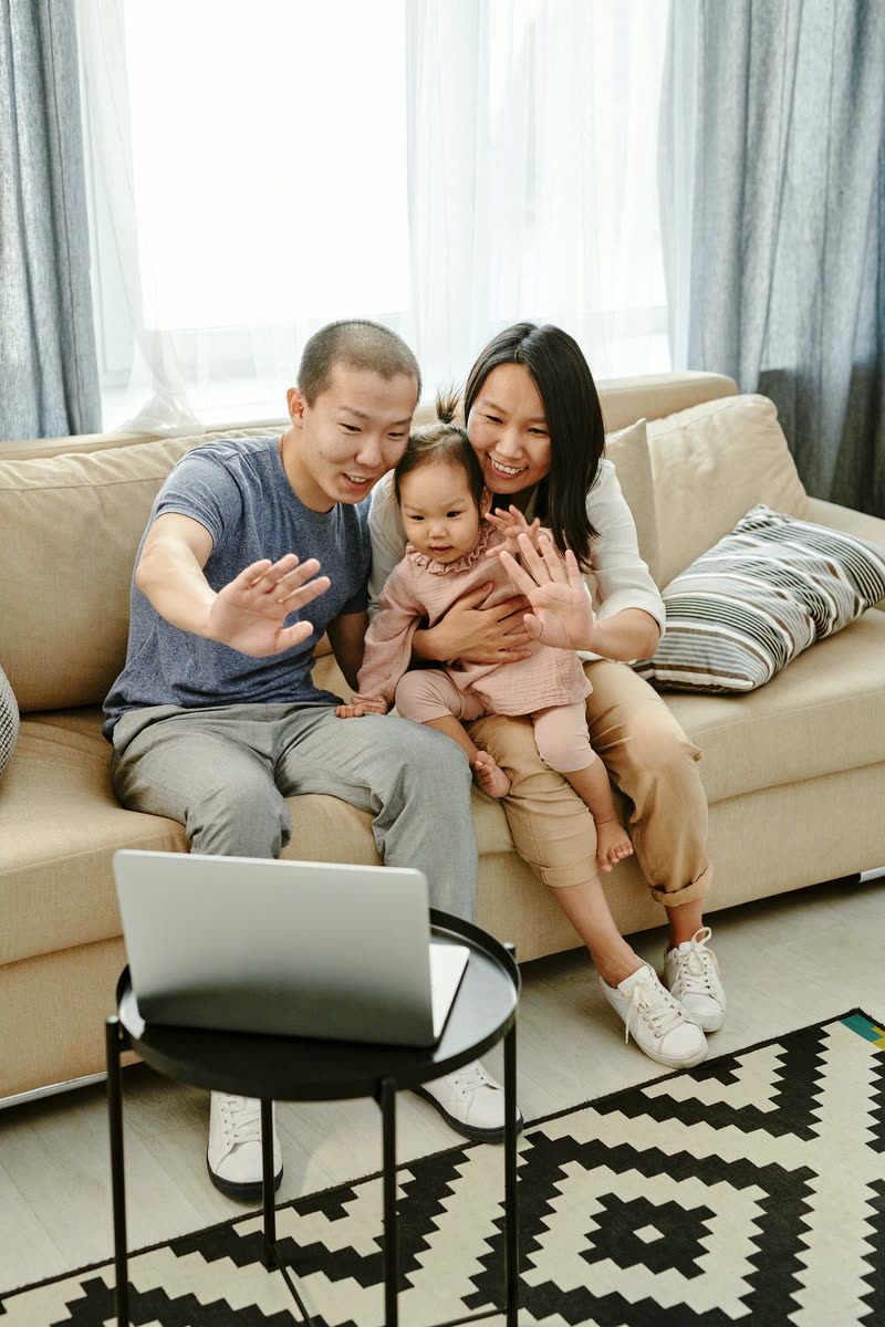 A family celebrating together on a video call