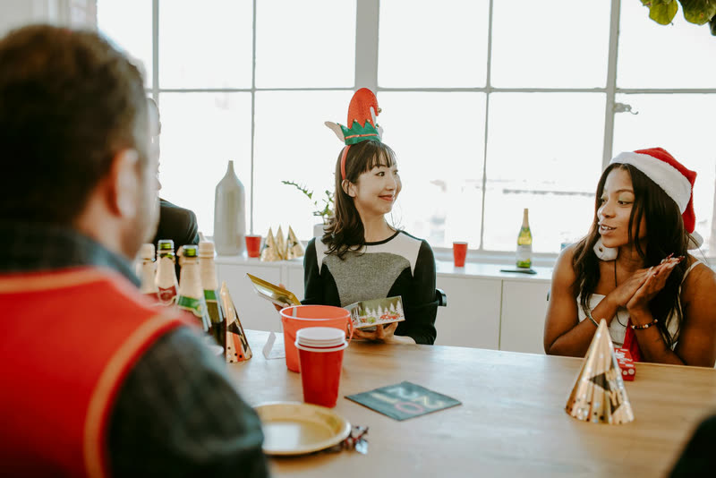 Coworkers exchanging gifts at a holiday party