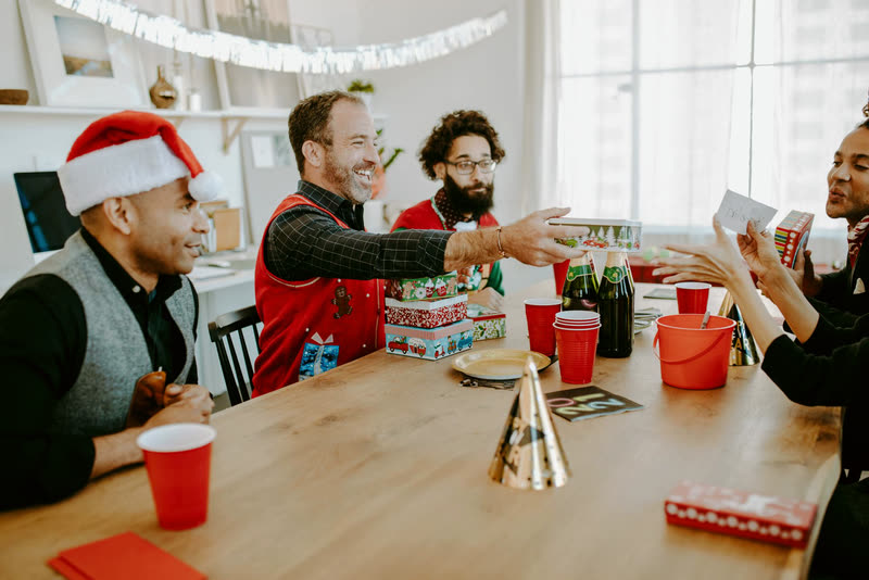 A team exchanging gifts together
