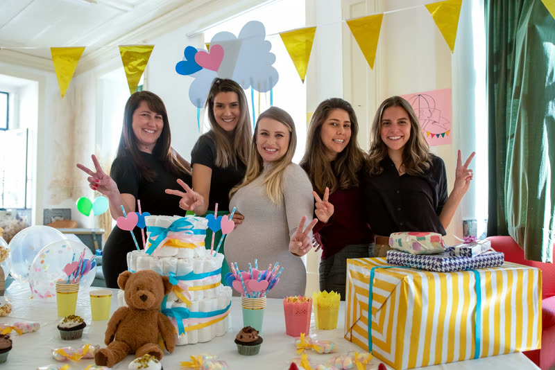 Friends bringing gifts to welcome a new baby